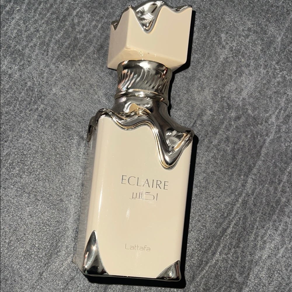 Lattafa Eclaire Fragrance Bottle - Cream and Silver